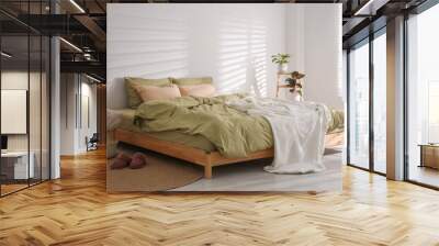 Large bed with soft blanket in stylish room interior Wall mural