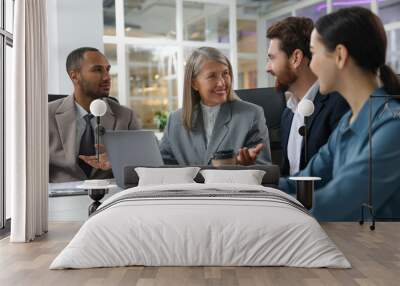 Lawyers working together at table in office Wall mural