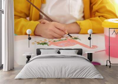 Little child painting at table, closeup view Wall mural