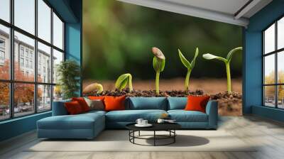 little green seedlings growing in fertile soil against blurred background Wall mural