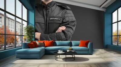 male security guard in uniform on dark background, closeup Wall mural