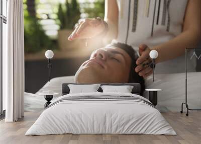 Man during healing session in therapy room Wall mural