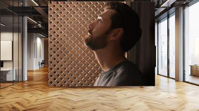 Man listening to priest during confession in booth, space for text Wall mural