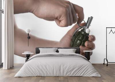 Man pulling safety pin out of hand grenade on white background, closeup Wall mural