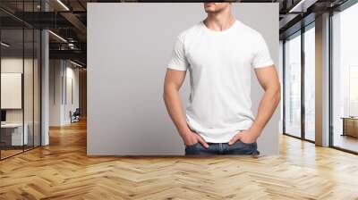 Man wearing white t-shirt on light grey background, closeup. Mockup for design Wall mural