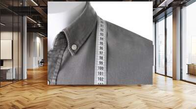 Mannequin with shirt and measuring tape on white background, closeup Wall mural