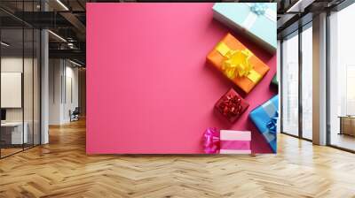 Many colorful gift boxes on pink background, flat lay. Space for text Wall mural