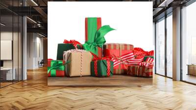 Many different Christmas gifts on wooden table against white background Wall mural