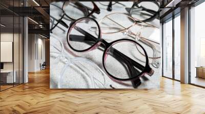 Many different glasses on light grey background, closeup Wall mural