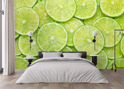 Many fresh juicy lime slices as background, top view Wall mural