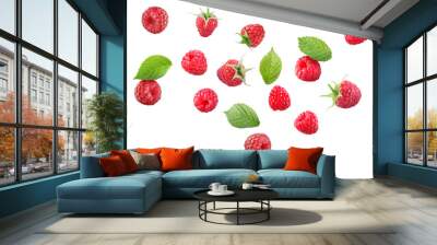 Many fresh ripe raspberries and green leaves falling on white background Wall mural