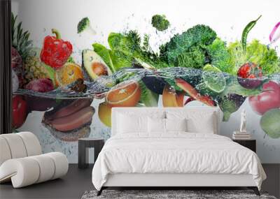 Many fruits and vegetables falling into water against white background Wall mural