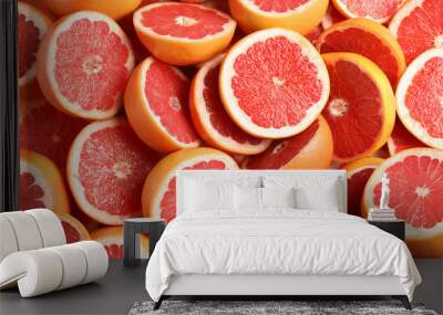 Many sliced fresh grapefruits as background, top view Wall mural