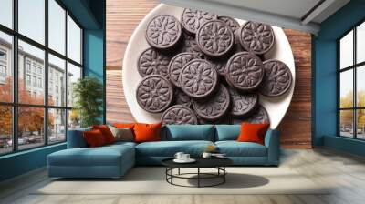 Many tasty sandwich cookies on wooden table, top view Wall mural