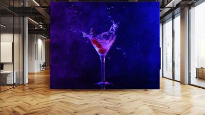 Martini splashing out of glass on table in neon lights Wall mural