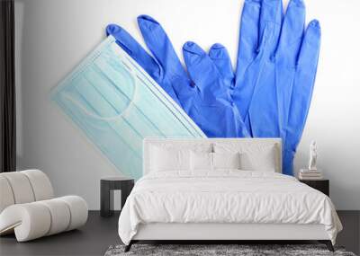 Medical gloves and protective face mask on white background, top view Wall mural