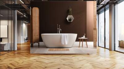 Modern ceramic bathtub with towel near brown wall in room Wall mural