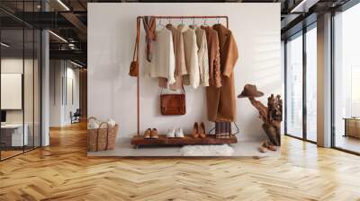 Modern dressing room interior with rack of stylish shoes and women's clothes Wall mural