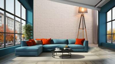 Modern floor lamp against brick wall indoors. Space for text Wall mural