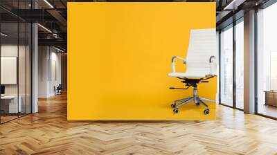 Modern office chair on yellow background. Space for text Wall mural