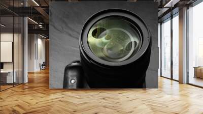 Modern photo camera on black table, closeup Wall mural