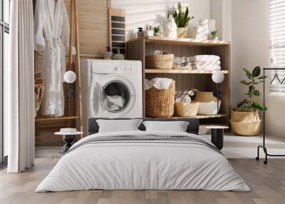 Modern washing machine and shelving unit in laundry room interior Wall mural