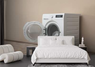 Modern washing machine with laundry near color wall, space for text Wall mural