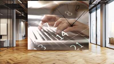 Multiple exposure of woman working on laptop, calendar and clock Wall mural