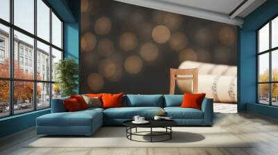 Music note and sheets on table against blurred lights, space for text. Bokeh effect Wall mural