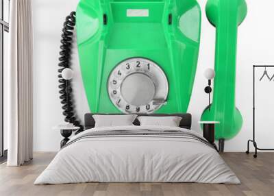 Old green telephone with rotary dial isolated on white, top view Wall mural