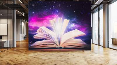 Open book with glitter overlay and beautiful universe on background Wall mural