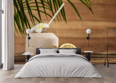 Open fresh coconut and citrus fruits on wooden table. Space for text Wall mural