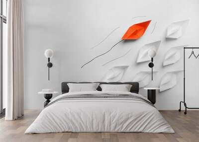 Orange paper boat floating past others on white background, flat lay with space for text. Uniqueness concept Wall mural