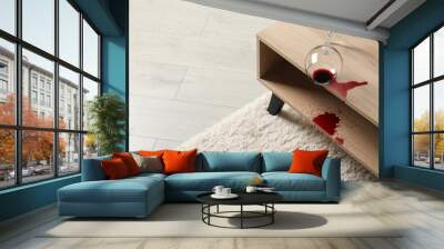 Overturned glass and spilled red wine on white carpet indoors, space for text Wall mural