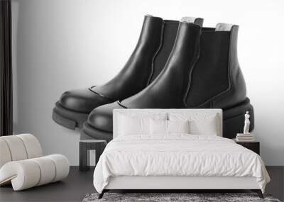 Pair of stylish boots on white background Wall mural