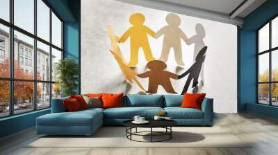 Paper people holding hands on light background. Unity concept Wall mural