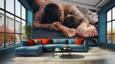 Passionate couple having sex on bed, focus on hands Wall mural