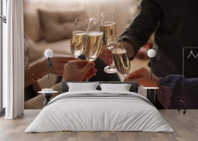 People clinking glasses with champagne at home, closeup Wall mural