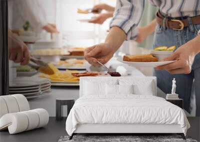 People near table with different dishes during breakfast, closeup. Buffet service Wall mural