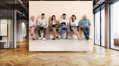 People waiting for job interview in office Wall mural