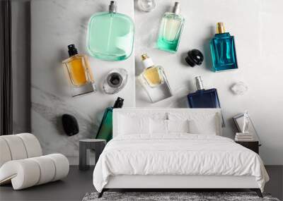 Perfume bottles on light background, flat lay Wall mural