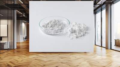 Petri dish and calcium carbonate powder on white background Wall mural