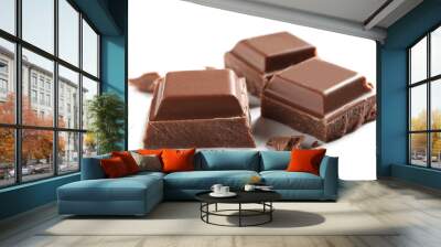 Pieces of tasty milk chocolate on white background Wall mural