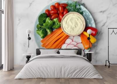 Plate with delicious hummus and fresh vegetables on white marble table, top view Wall mural