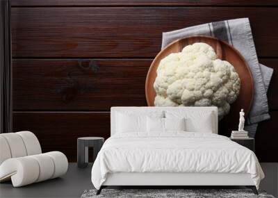 Plate with fresh raw cauliflower on wooden table, top view. Space for text Wall mural