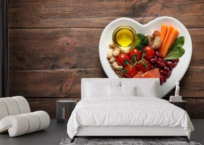 Plate with heart-healthy diet products on wooden background, top view. Space for text Wall mural