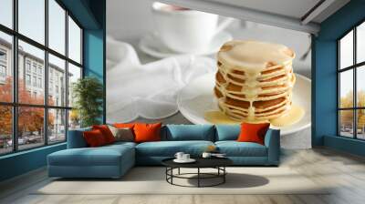 Plate with pancakes and condensed milk served on table, space for text. Dairy product Wall mural