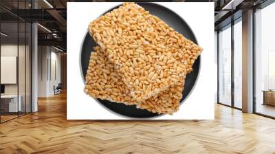 Plate with puffed rice bars (kozinaki) on white background, top view Wall mural