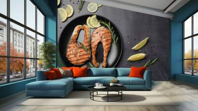 plate with tasty salmon steaks on black table, flat lay. space for text Wall mural