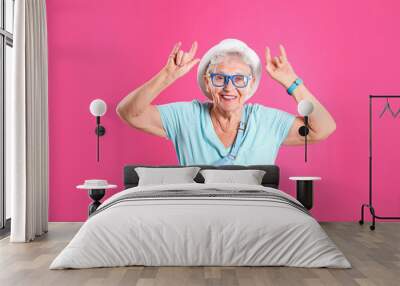 Portrait of cool grandmother on color background Wall mural